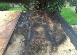Damaged flat roof repairs Kent