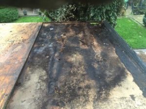 Damaged flat roof repairs Kent